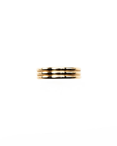 A stack of three slim gold rings centered on a plain white background.